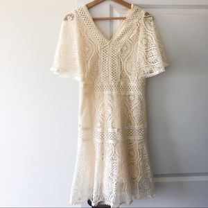 Lace flared dress with flutter cape sleeves